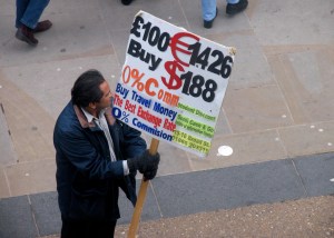 man on the street offering to exchange foreign money